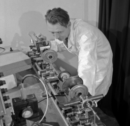 Photo of Bernard Fairchild in optical fibre lab.